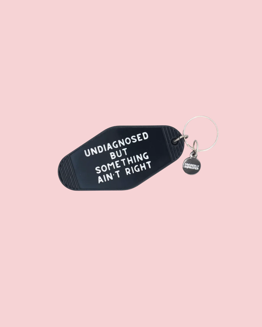 Something Ain't Right Hot Stamped Motel Keychain
