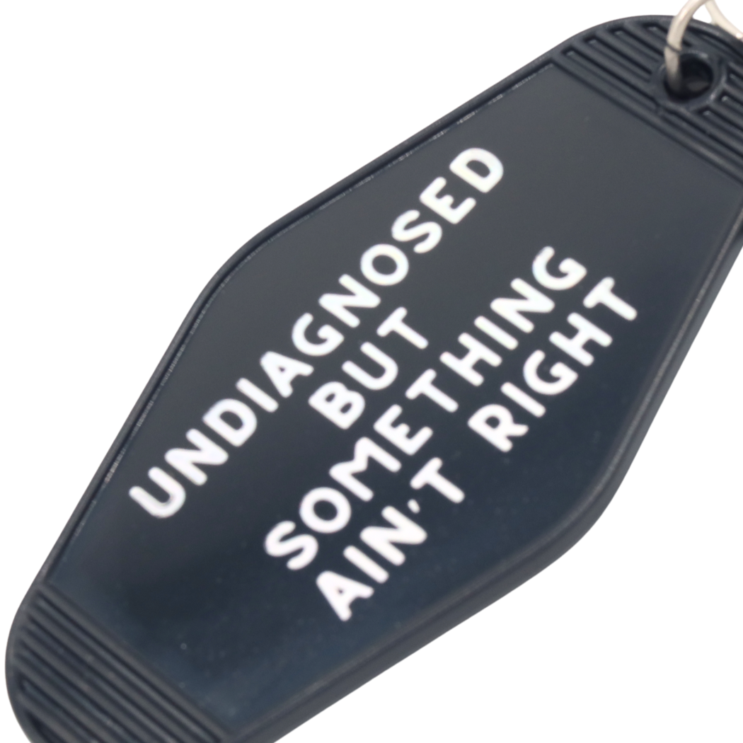 Something Ain't Right Hot Stamped Motel Keychain
