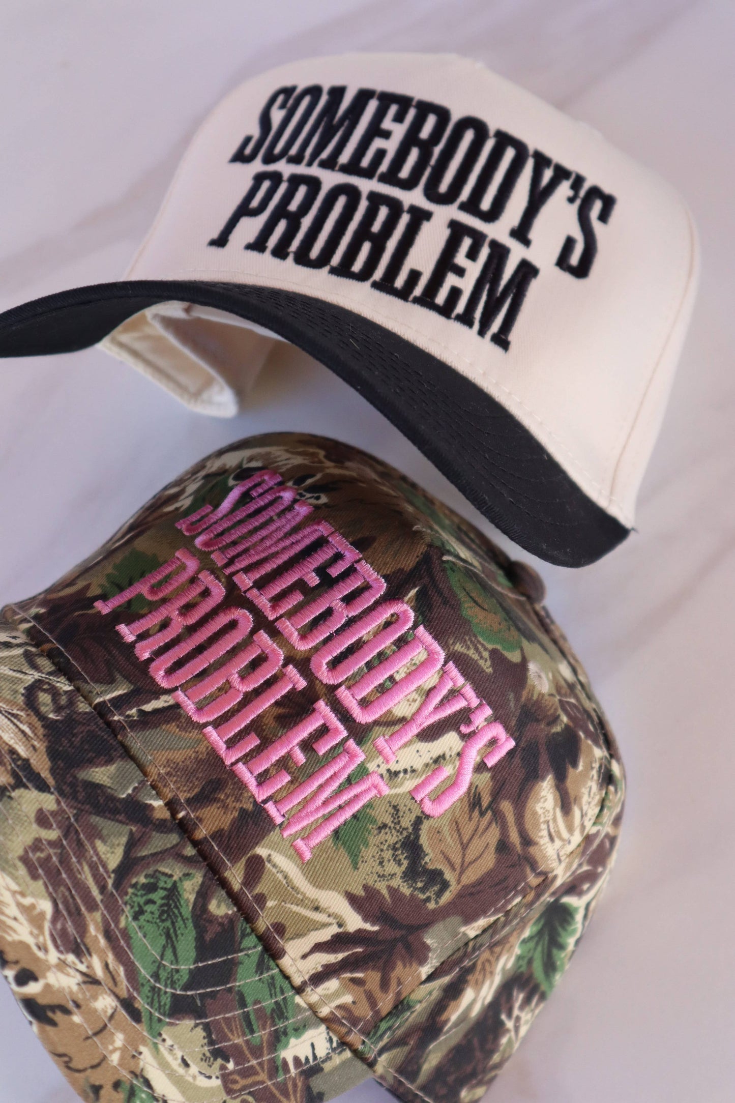 Somebody's Problem Embroidered Trucker Hat