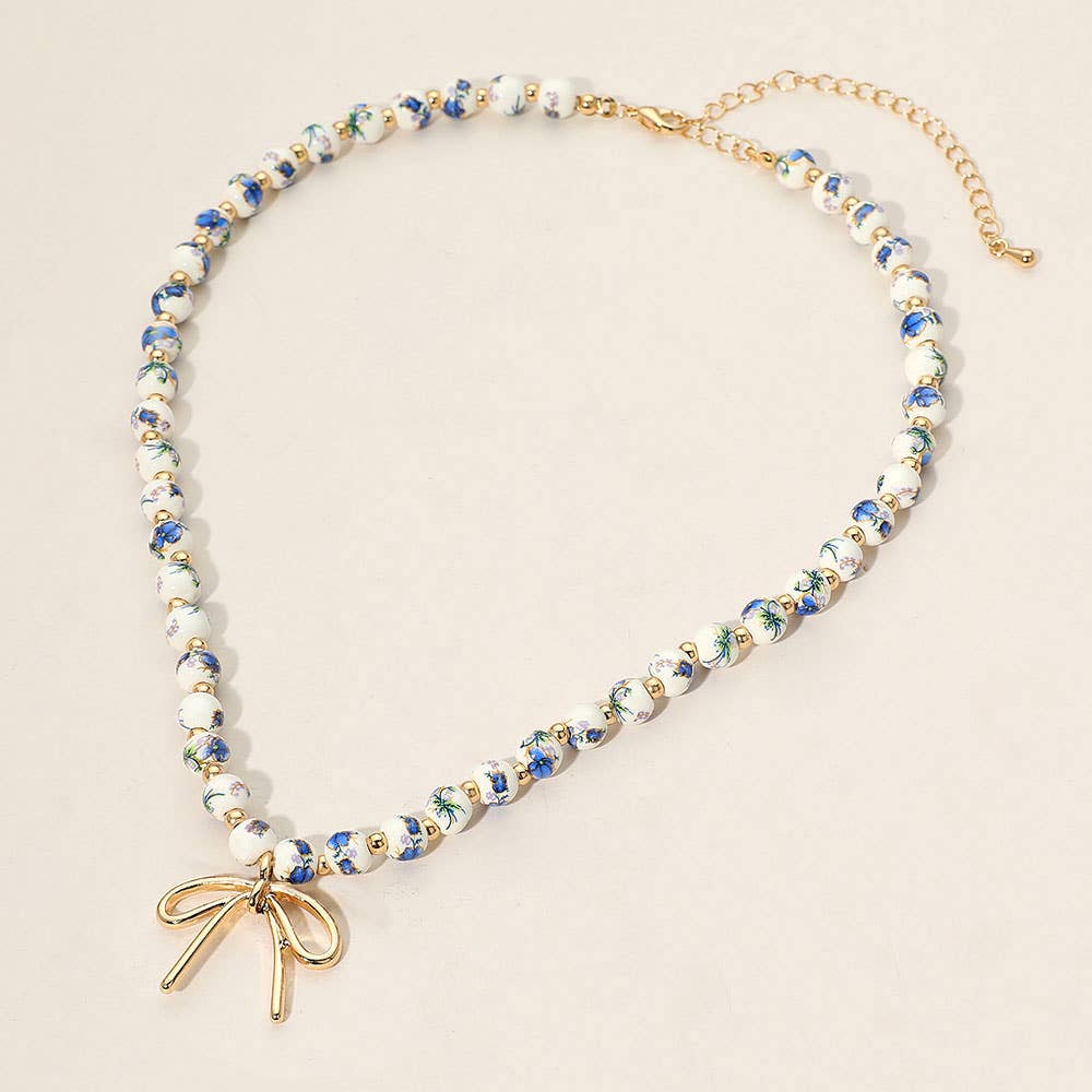 Metal Bow Pendant Floral Printed Ceramic Ball Beaded Necklace