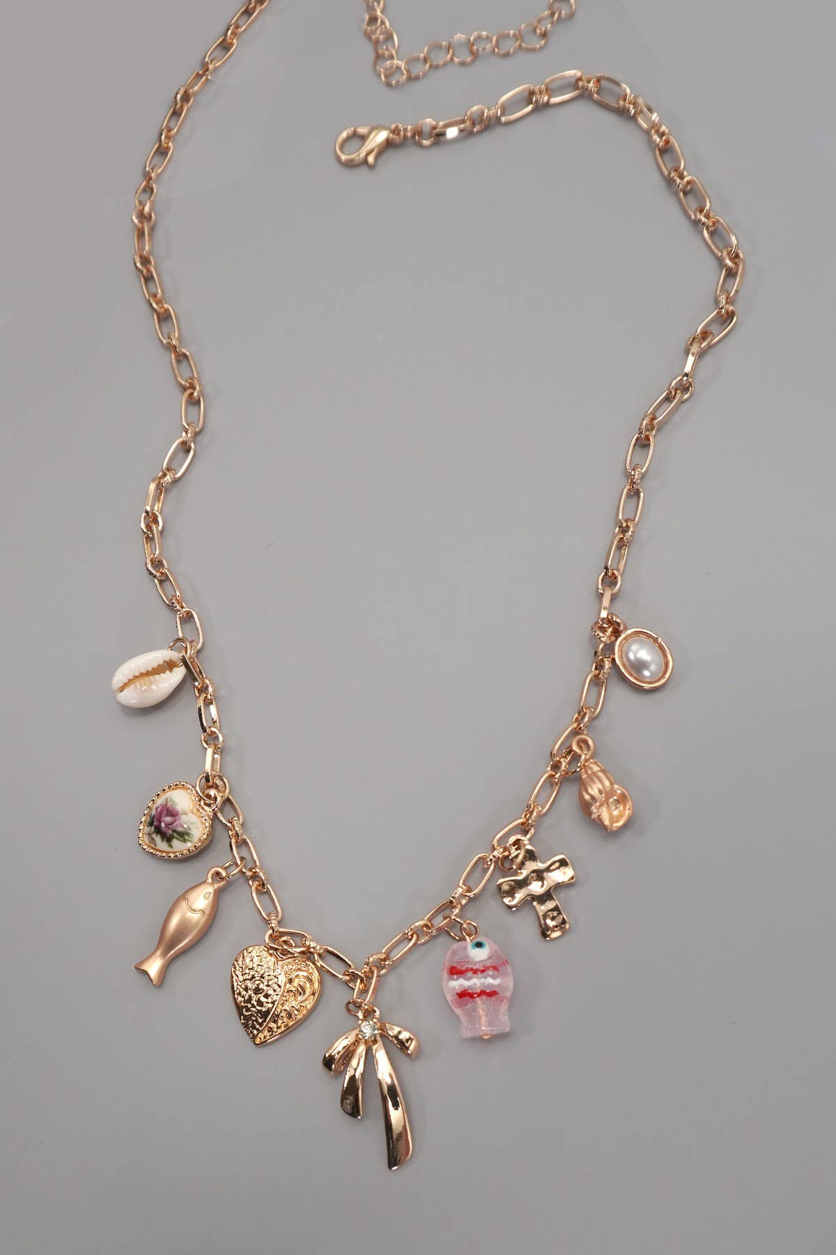CHARM NECKLACE-FISH BOW CHARM PEARL SHELL CROSS