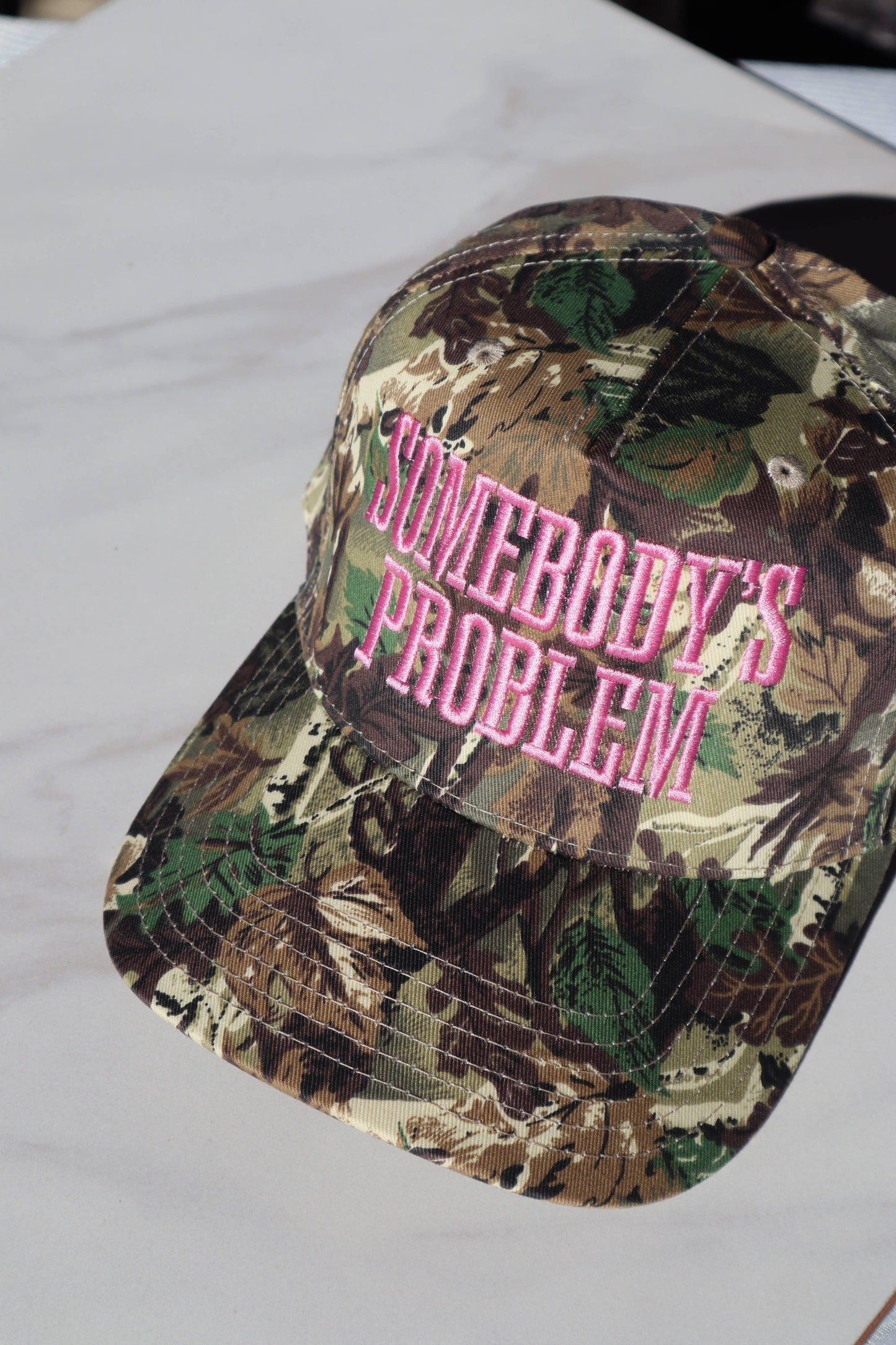 Somebody's Problem Embroidered Trucker Hat